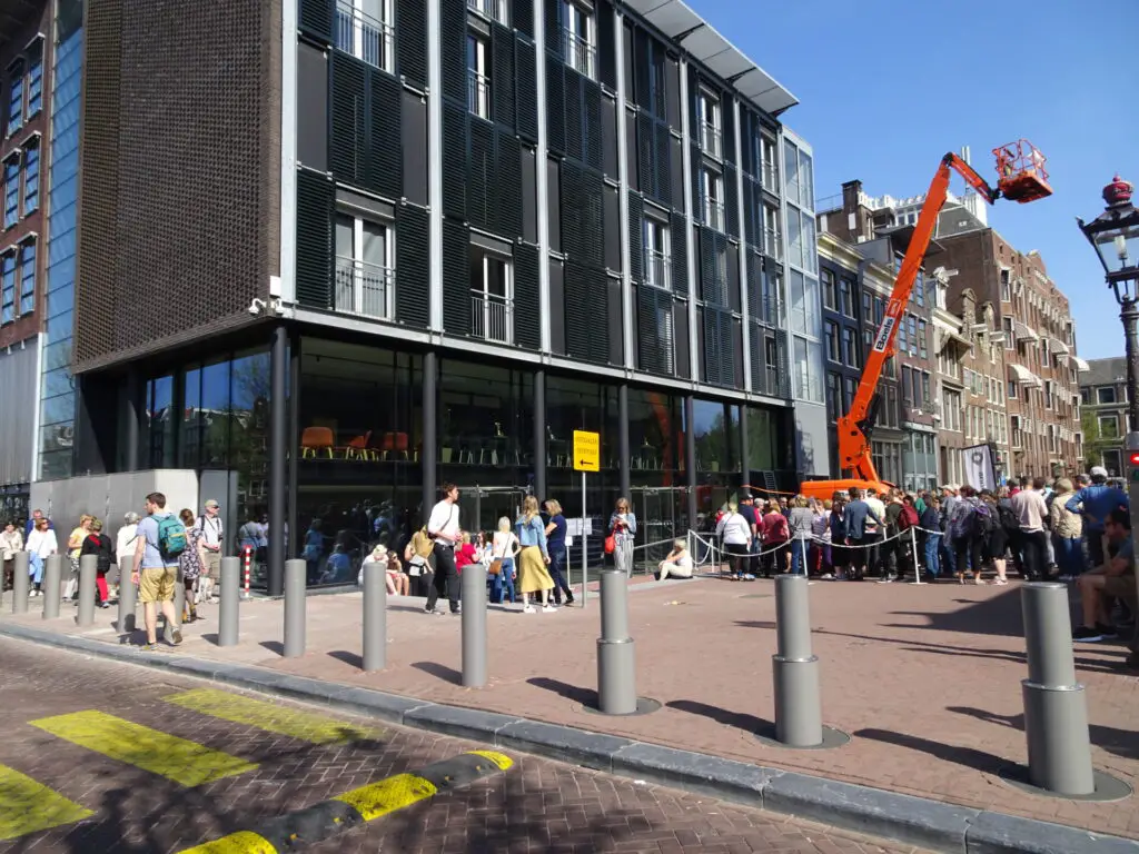 queue outside the entrance to the anne frank house museum netherlands