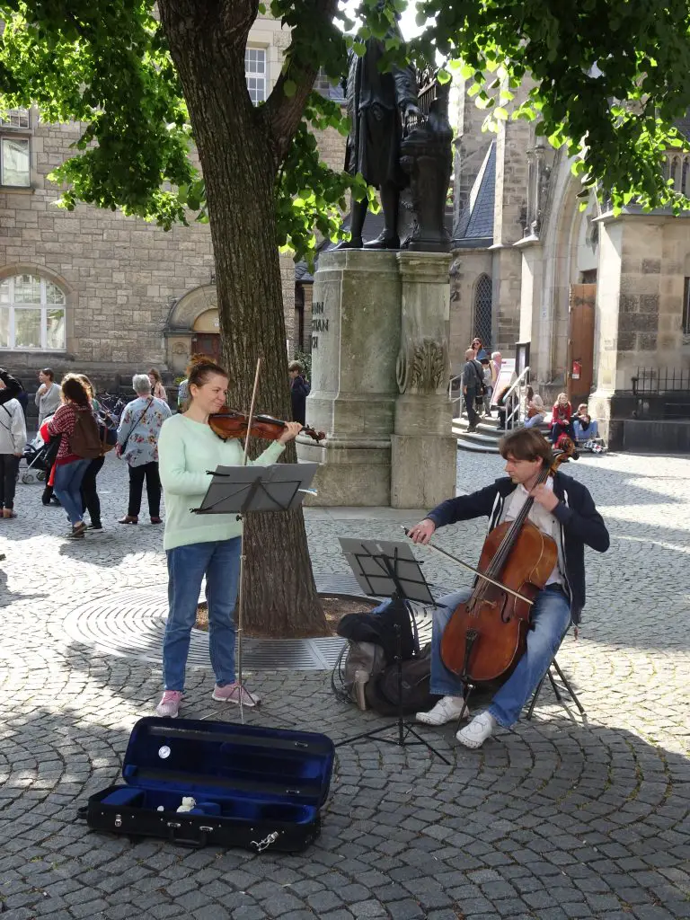 Performers in the square outside St. Thomas Church, Leipzig, Germany