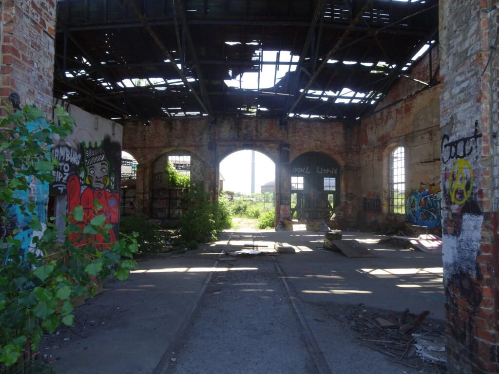 tracks of the former railway visible inside the abandoned vehicle maintenance building for the german state railway