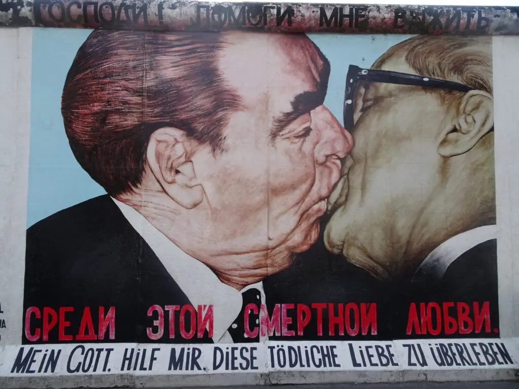 Dmitri Vrubel's Fraternal Kiss kissing men painting mural berlin wall