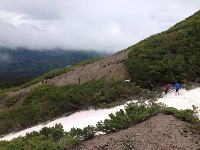 snow fields on the mount meakan hiking trail hokkaido japan