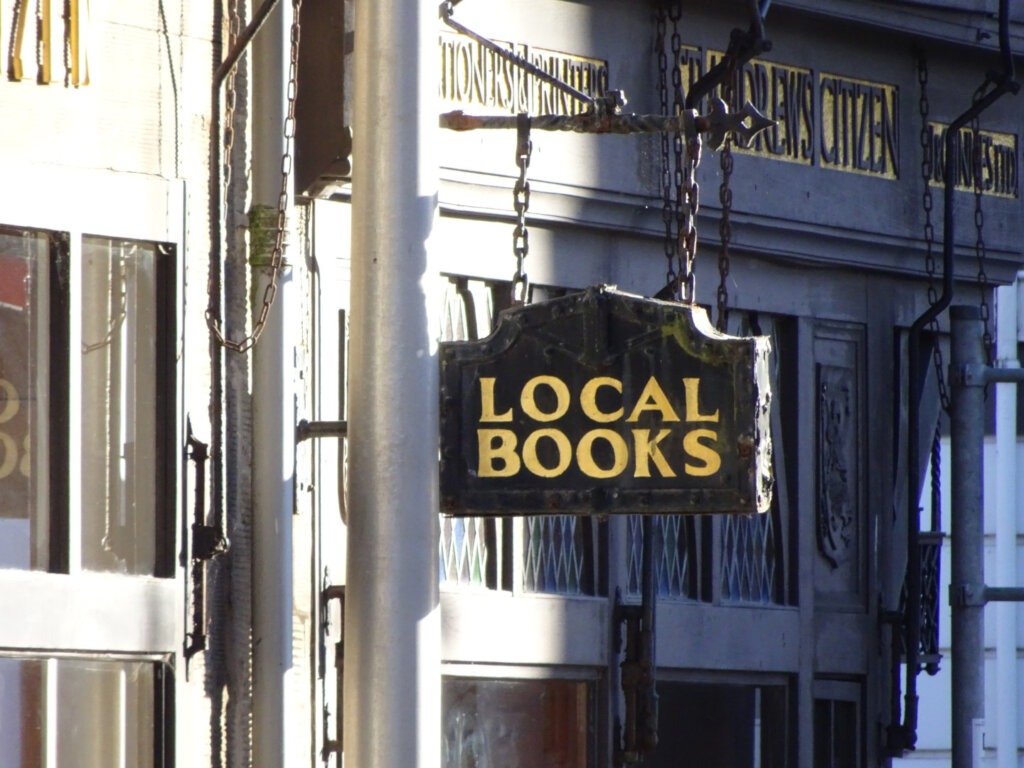 local books shop sign cute old scottish market lane st andrews scotland