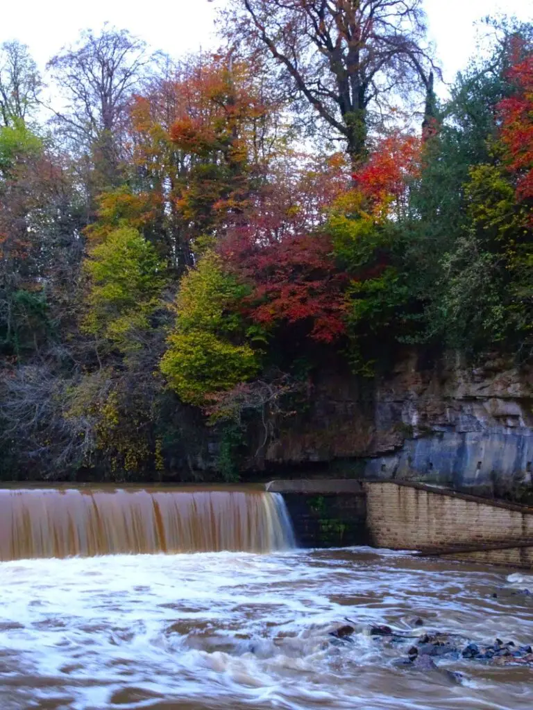 river almond walkway waterfall in autumn