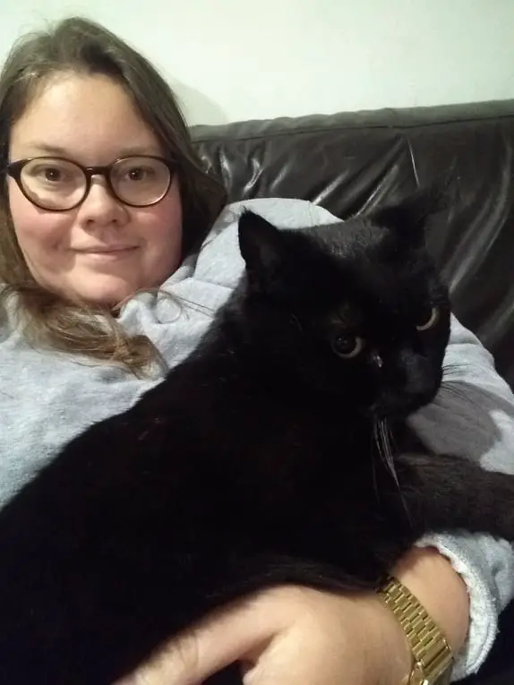 lauren sitting holding black cat
