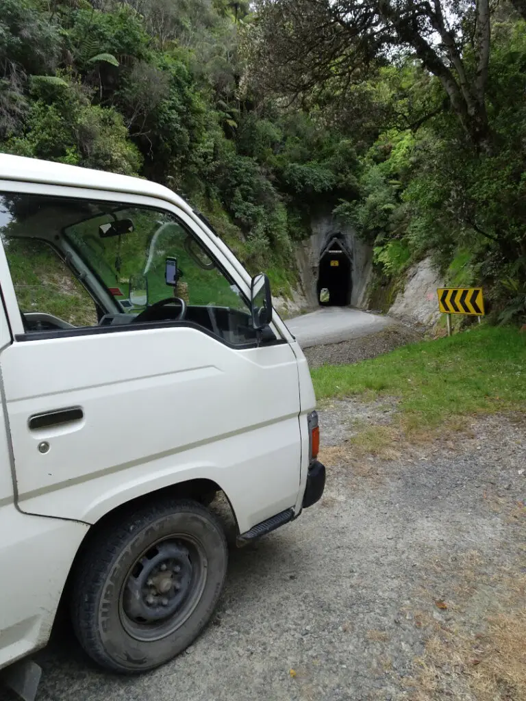 white van on the forgotten world highway outside moki tunnel new zealand north island road trip