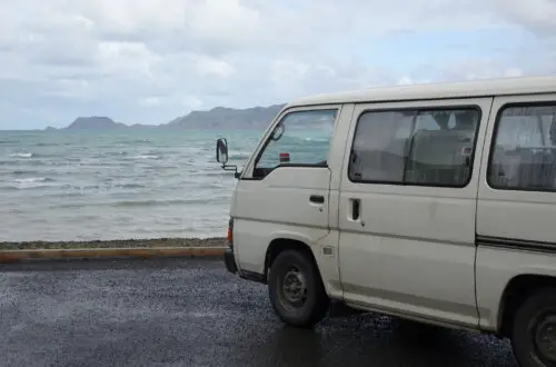 buy a campervan in new zealand parked next to sea east cape new zealand