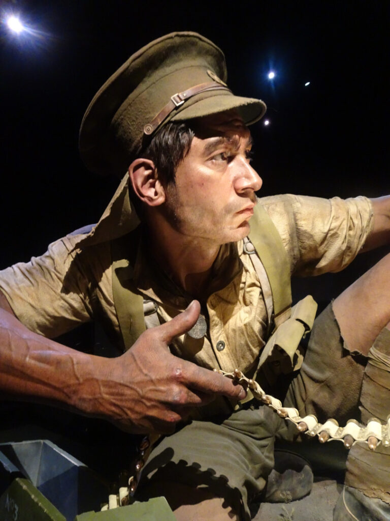 a lifelike giant sculpture of a soldier in world war i at the te papa at the gallipolli scale of war exhibit in wellington made by weta workshop