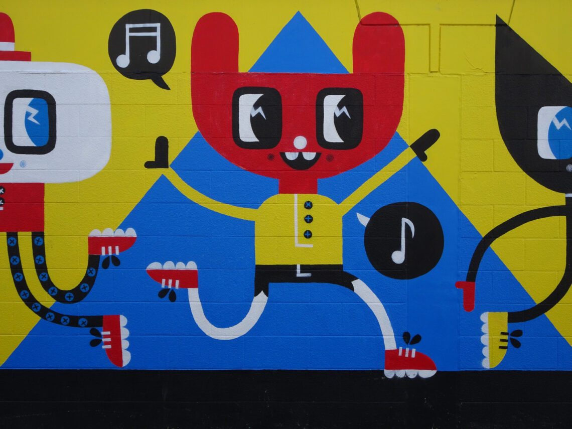 colorful street art character on a wall in taupo new zealand