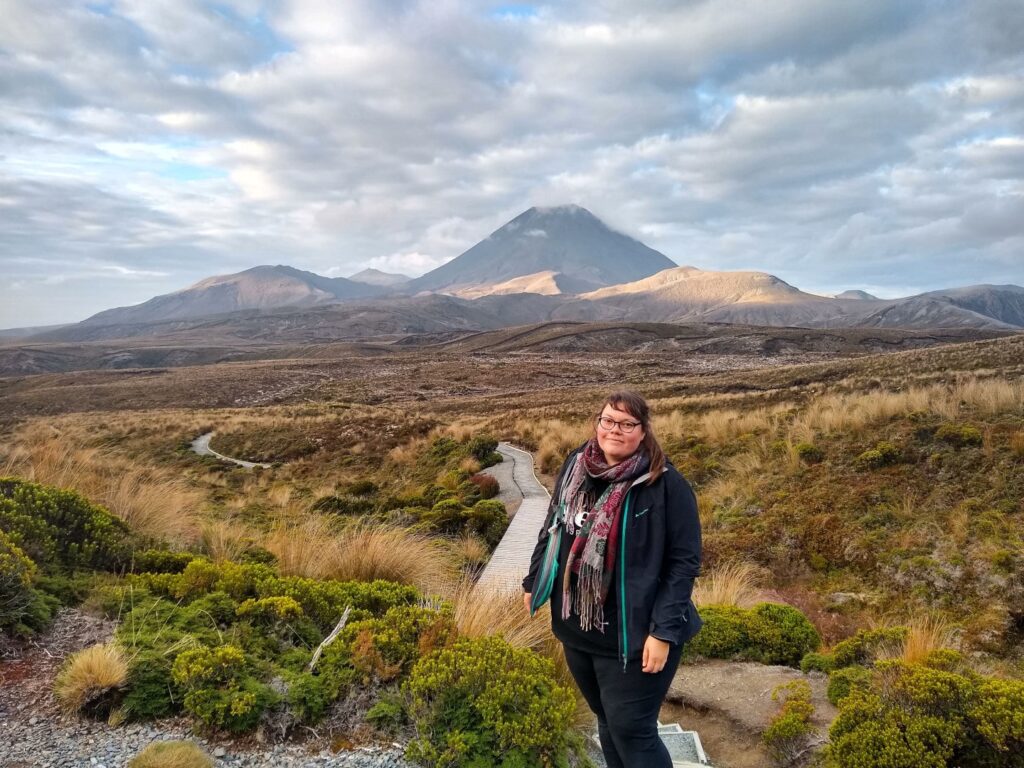 lauren standing on the tama lakes track in tongariro national park - must do north island experience in new zealand