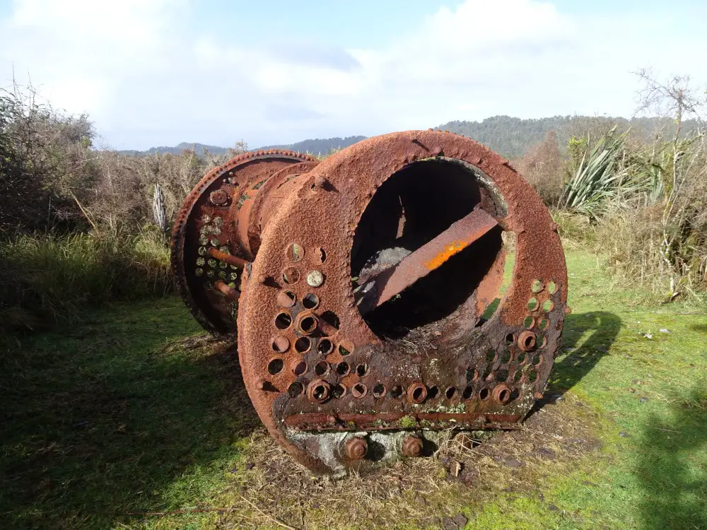 rusty historical artefact on the gillespies beach suction dredge loop walk old gold mining west coast new zealand