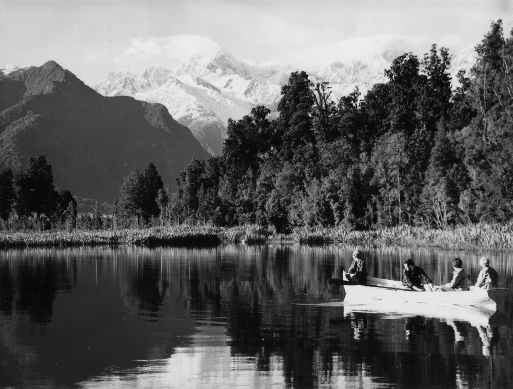 Tourists on Lake Matheson in 1965. Photo from the Archives New Zealand's National Publicity photo collection (Creative Commons)
