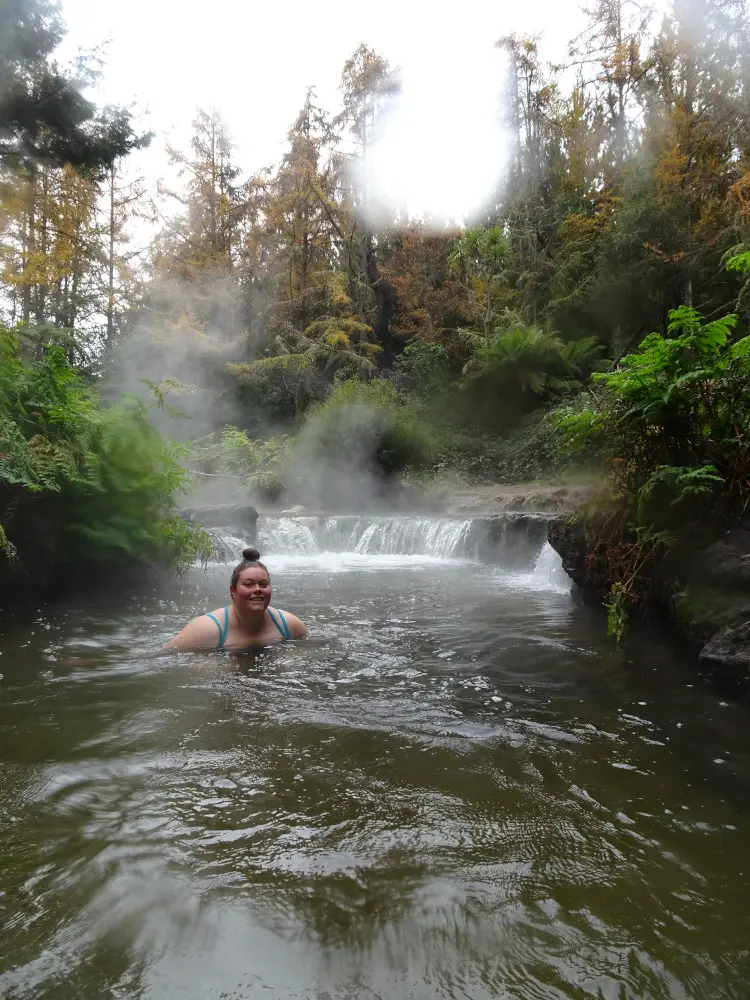 lauren at kerosene creek natural hot spring near rotorua in new zealand
