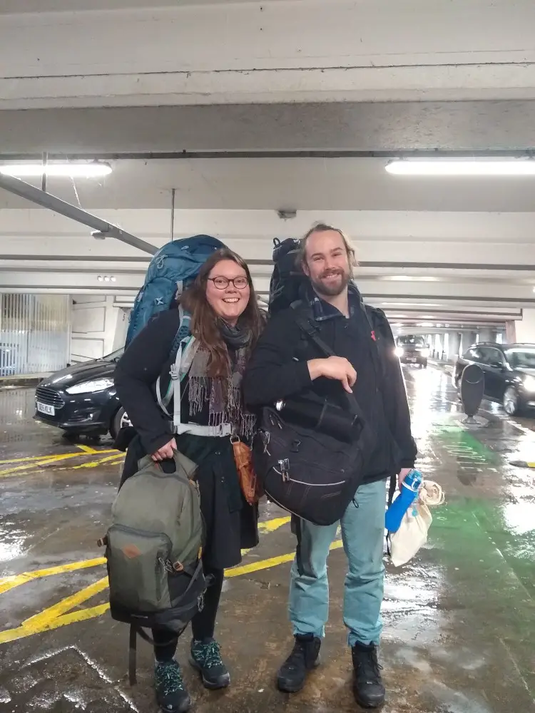 lauren and fiachra at the airport with backpacks ready to leave the uk in january 2020