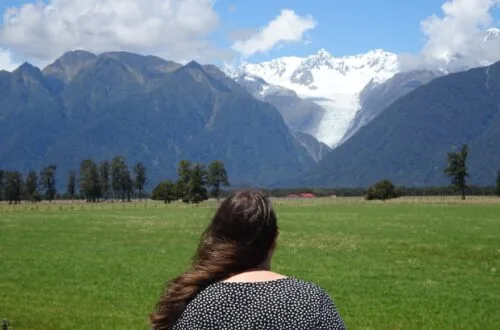 lauren viewing fox glacier on the west coast of the south island new zealand - best glaciers to visit new zealand