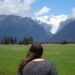 lauren viewing fox glacier on the west coast of the south island new zealand - best glaciers to visit new zealand
