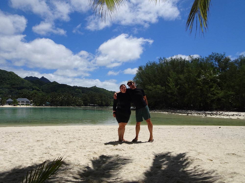 lauren and fiachra standing on muri lagoon beach in the cook islands