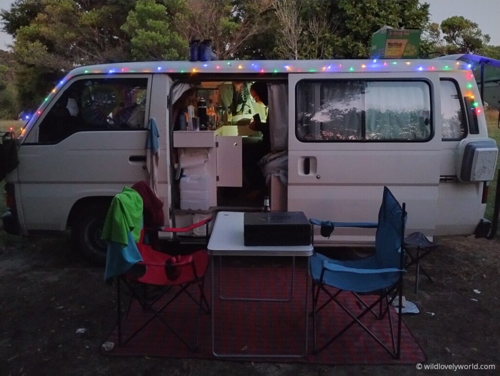 nissan caravan campervan camping at totaranui campervan at night with fairy lights