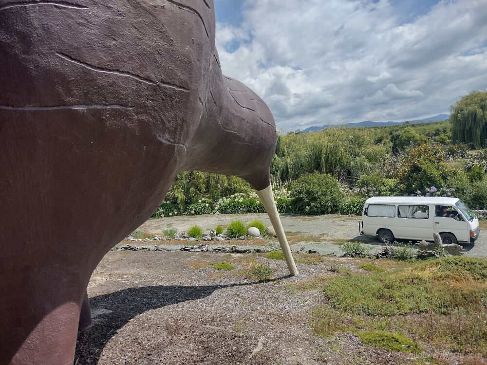 our campervan under the giant kiwi sculpture near motueka new zealand