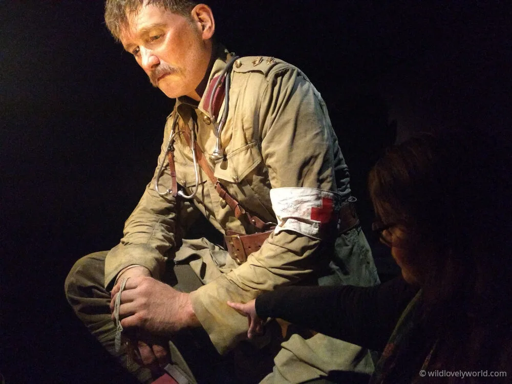 lauren pointing at a giant sculpture of an army soldier at the gallipoli exhibition in te papa museum of new zealand in wellington
