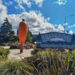 lauren standing in front of ohakune's big carrot statue at the ohakune carrot adventure park - giant sculpture in new zealand