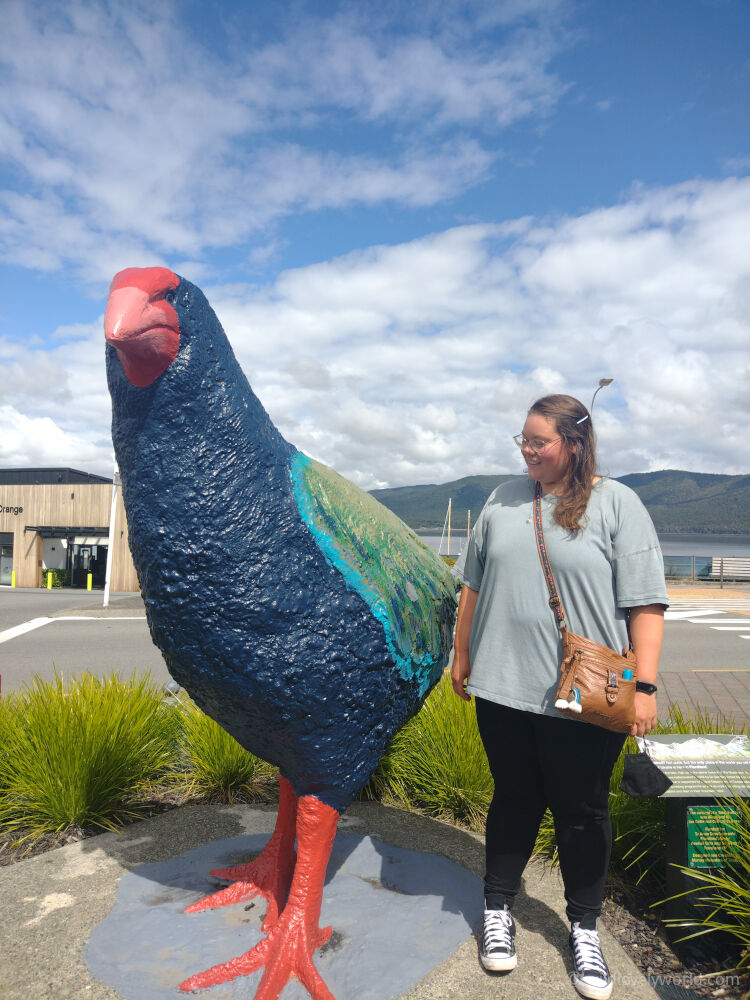 lauren with the giant takahe sculpture in te anau south island new zealand