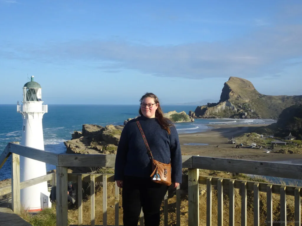 portrait of lauren at castle point scenic reserve and lighthouse with castle rock in new zealand north island near wellington