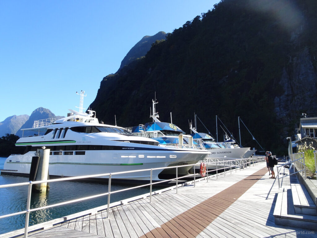milford sound cruise boats docked in the harbour in new zealand