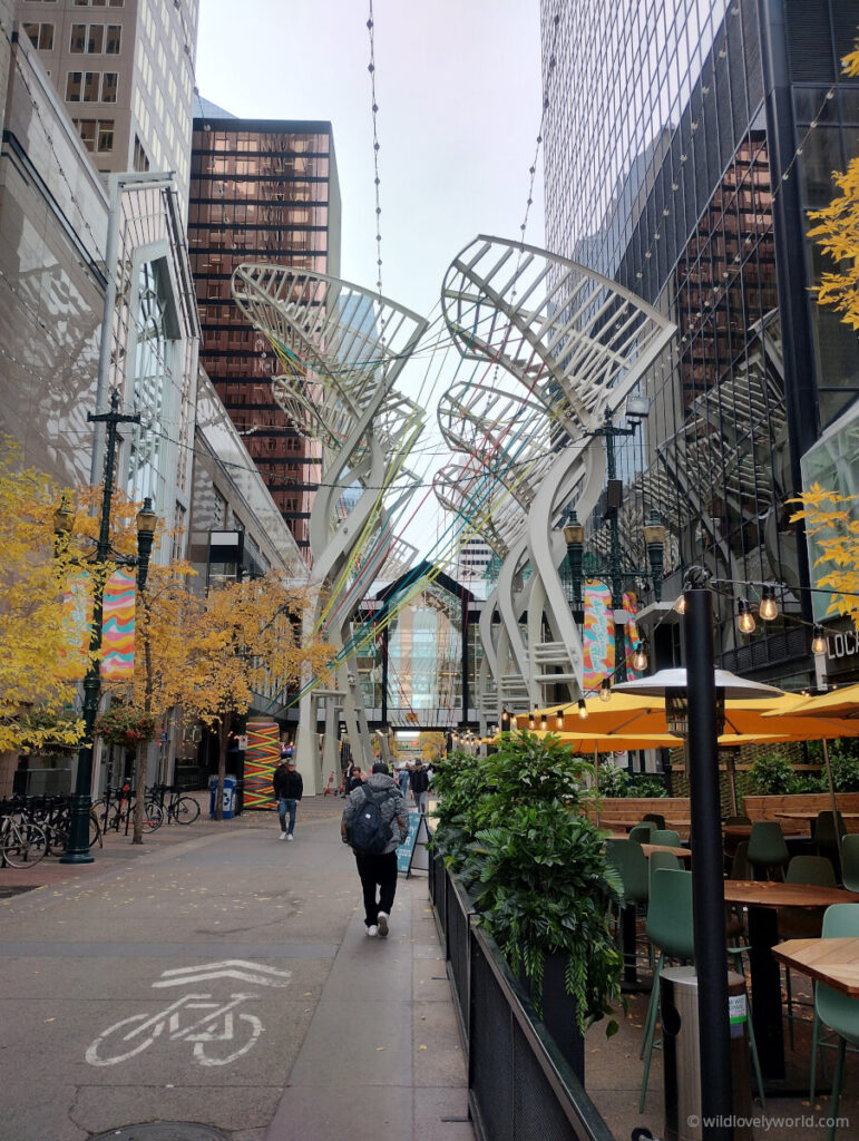 calgary pedestrian and cycle zone with sculptures, cafes and restaurants
