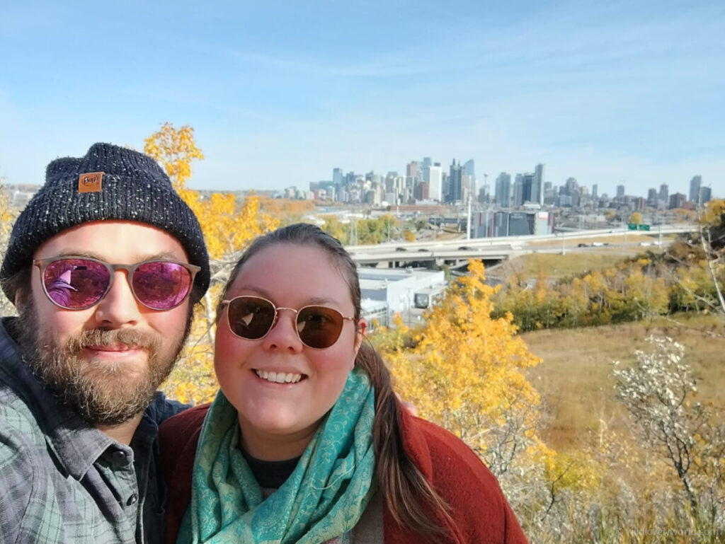 fiachra and lauren selfie in autumn in canada with calgary alberta downtown skyline in the background