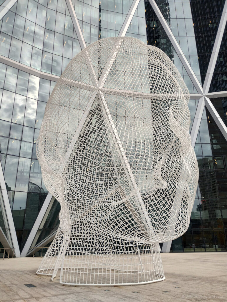 a wire head sculpture in calgary downtown outside the cibc bank building