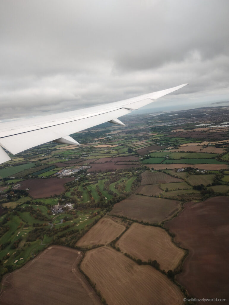 take off from dublin airport view out the window of the countryside in ireland