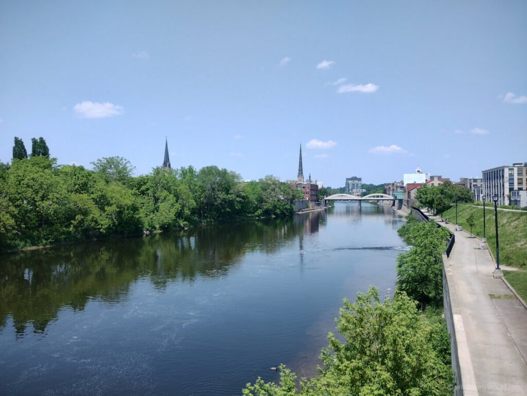 view of the grand river in cambridge, ontario, canada, with spires and the handmaids tale bridge