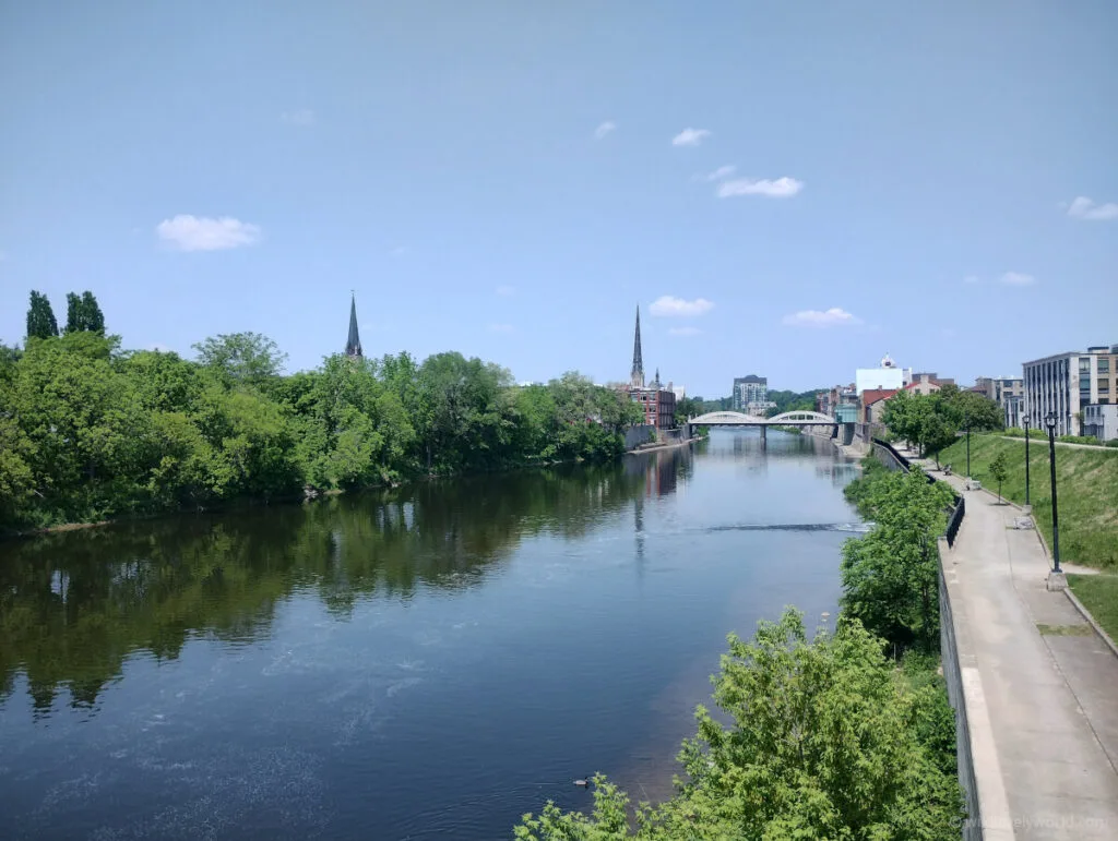 view of the grand river in cambridge, ontario, canada, with spires and the handmaids tale bridge