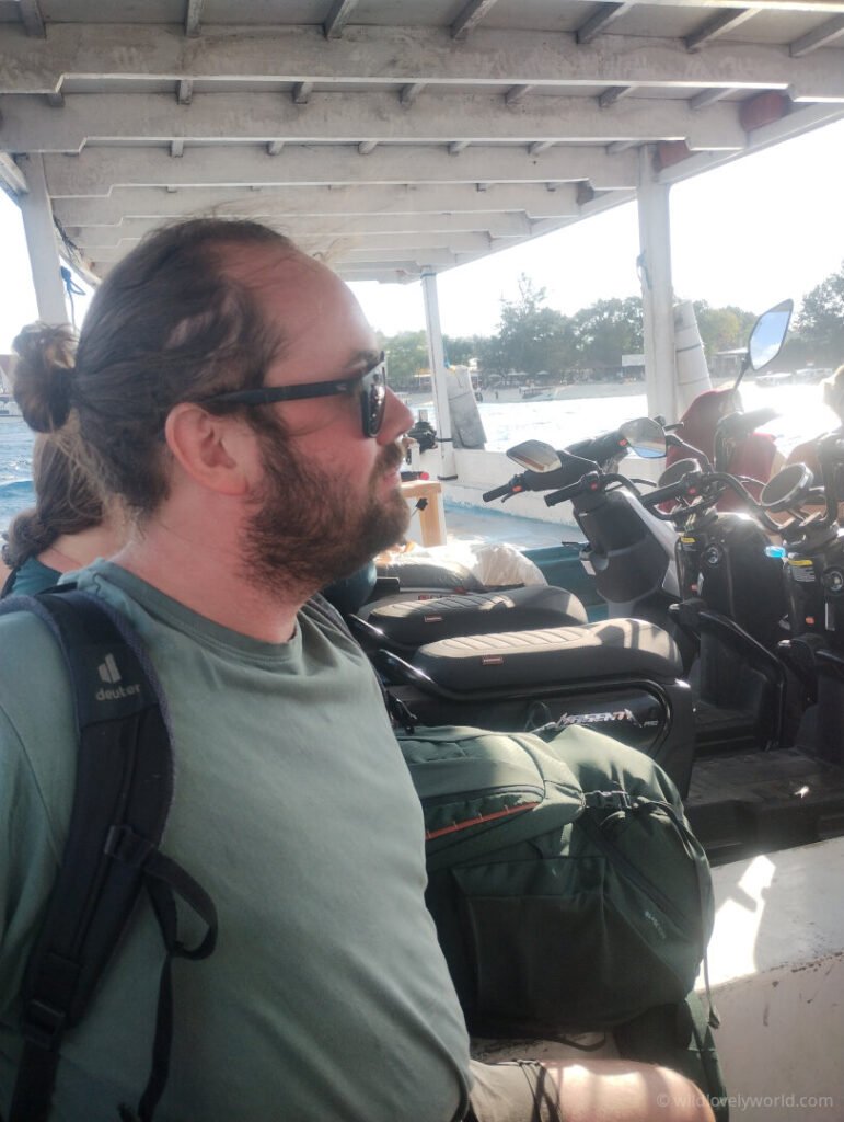 fiachra on the gili islands island hopping boat with bikes in the background