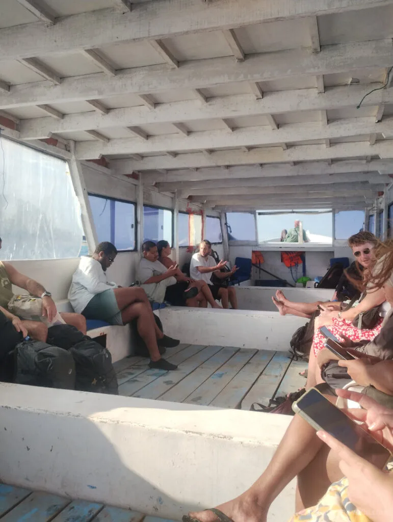 interior of the gili islands island hopping public slow boat showing bench seating and roof cover lombok indonesia