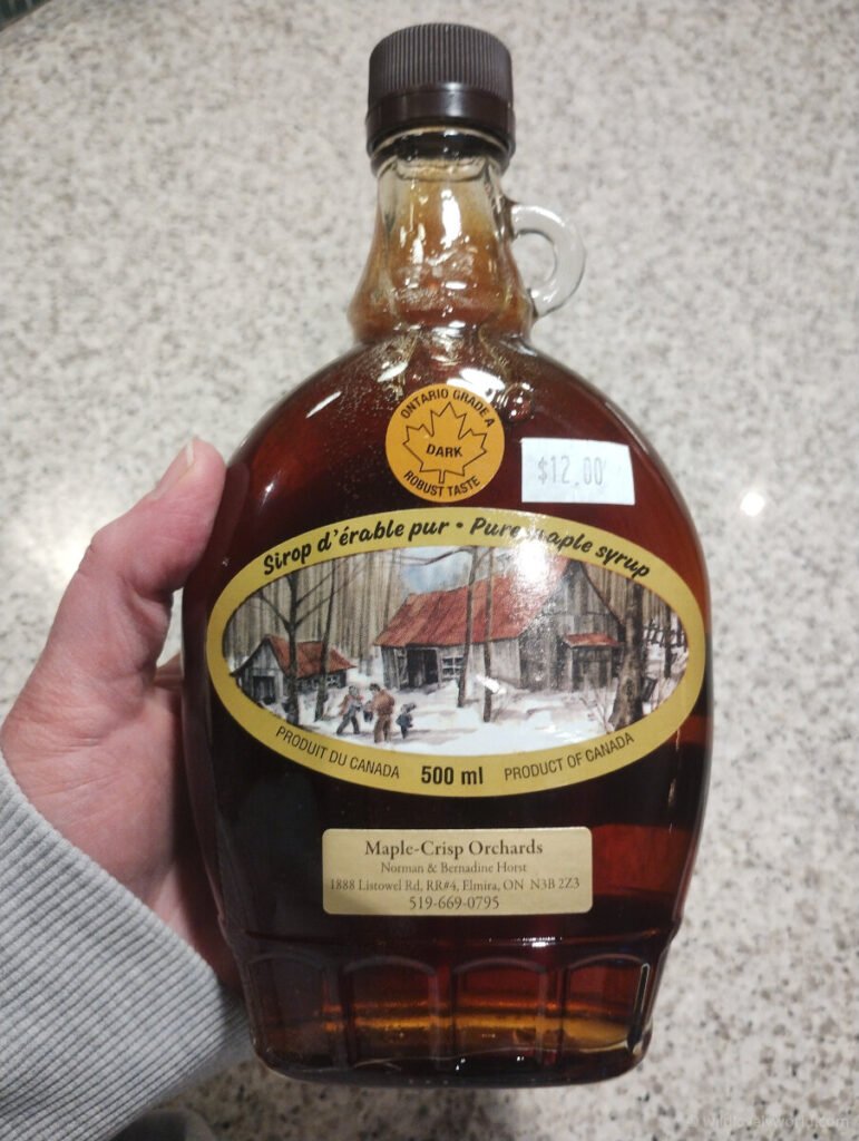 a bottle of dark grade maple syrup from elmira in ontario canada