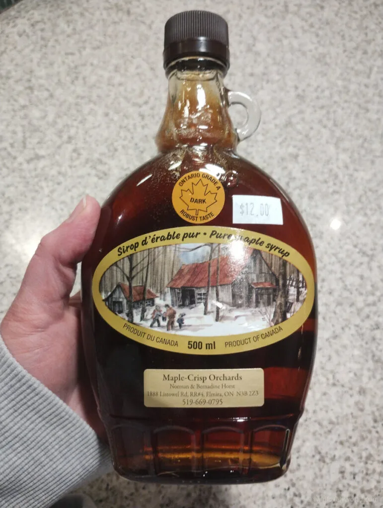 a bottle of dark grade maple syrup from elmira in ontario canada