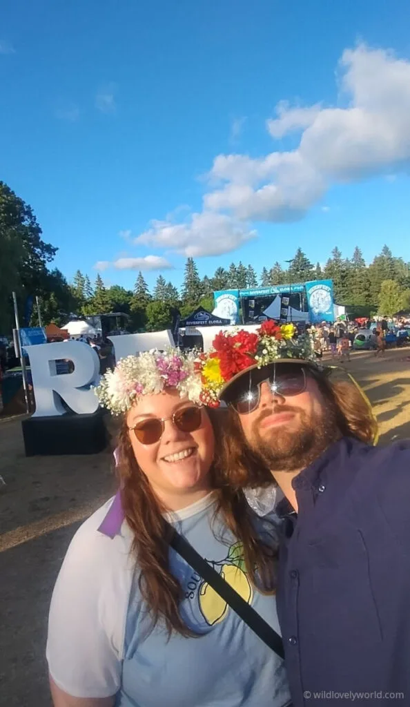 lauren and fiachra wearing flower crowns at the elora riverfest music festival