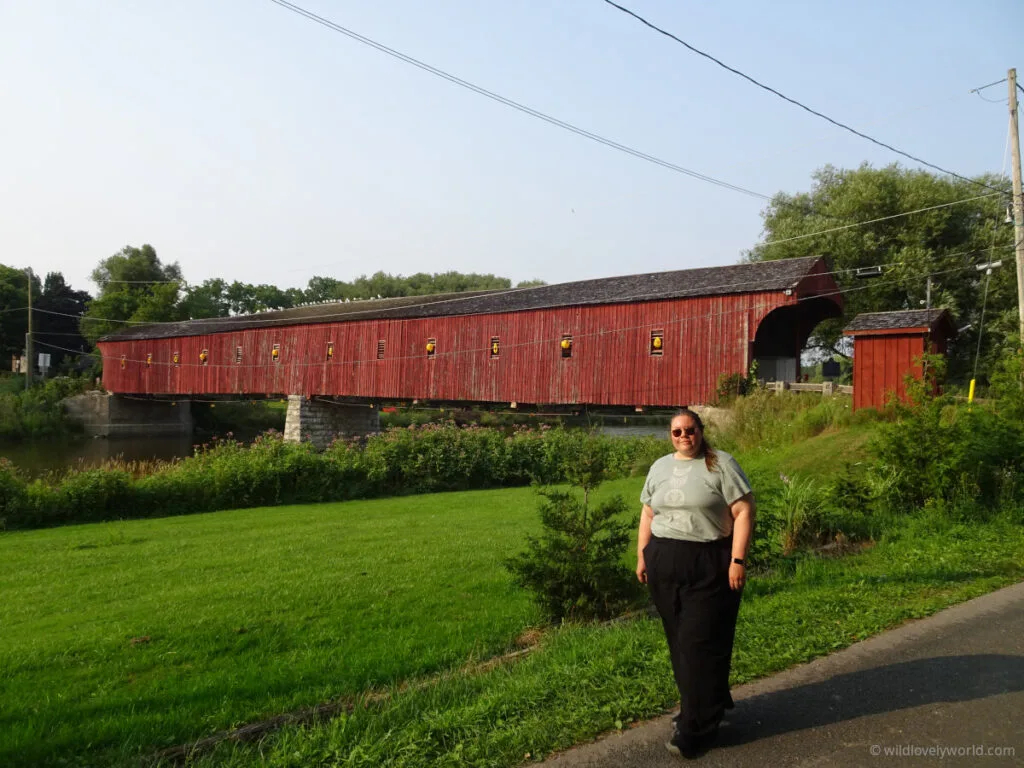 lauren standing in front of the west montrose covered bridge