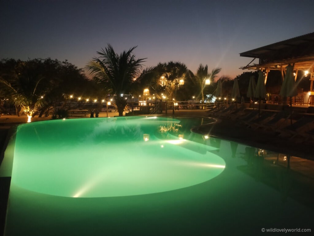 upper swimming pool at night next to the restaurant and facing the beach at le pirate gili meno