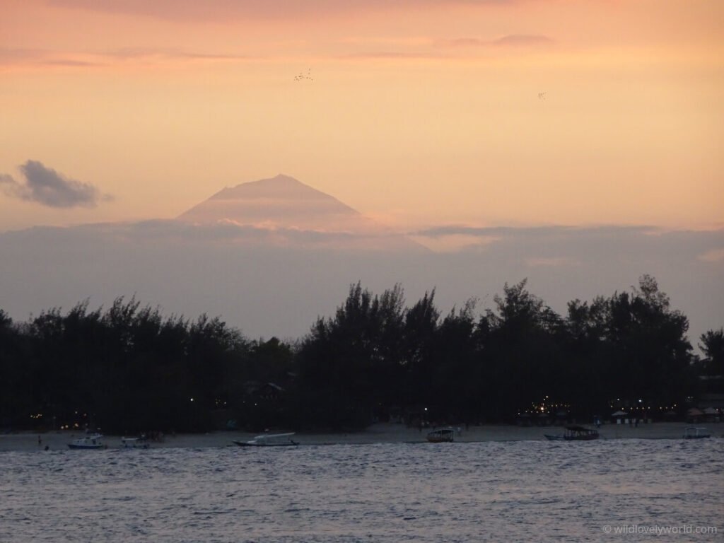 mount agung volcano bali viewed from gili islands gili meno at sunset