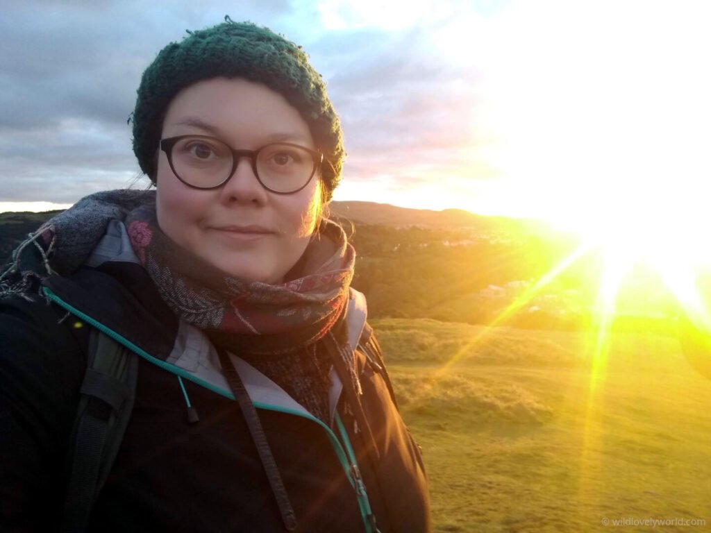 lauren viewing sunset at the top of blackford hill
