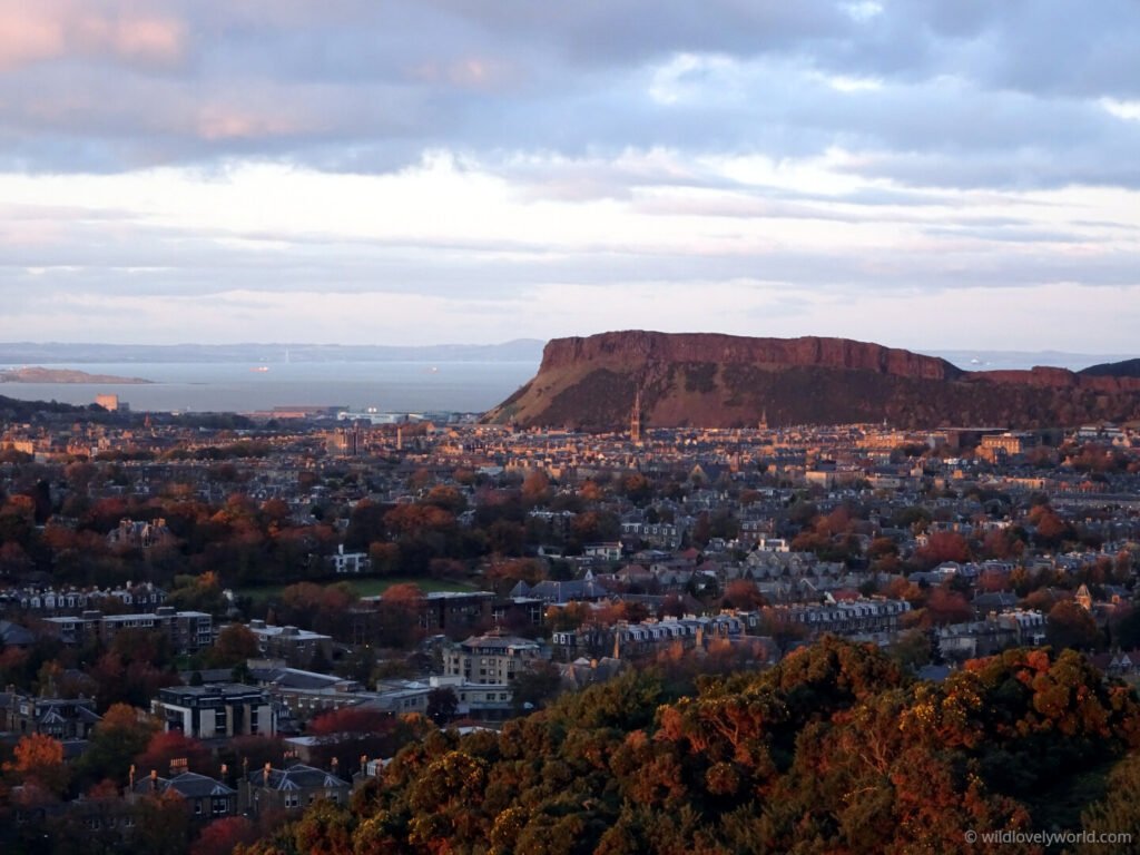 salisbury crags and edinburgh city view from blackford hill during golden hour